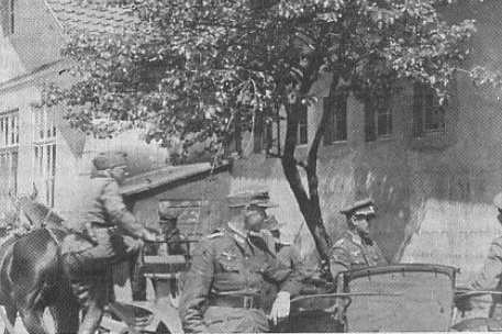 Author (centre) with arm resting on horse-drawn buggy, used by officers for conveyance around the camp grounds.